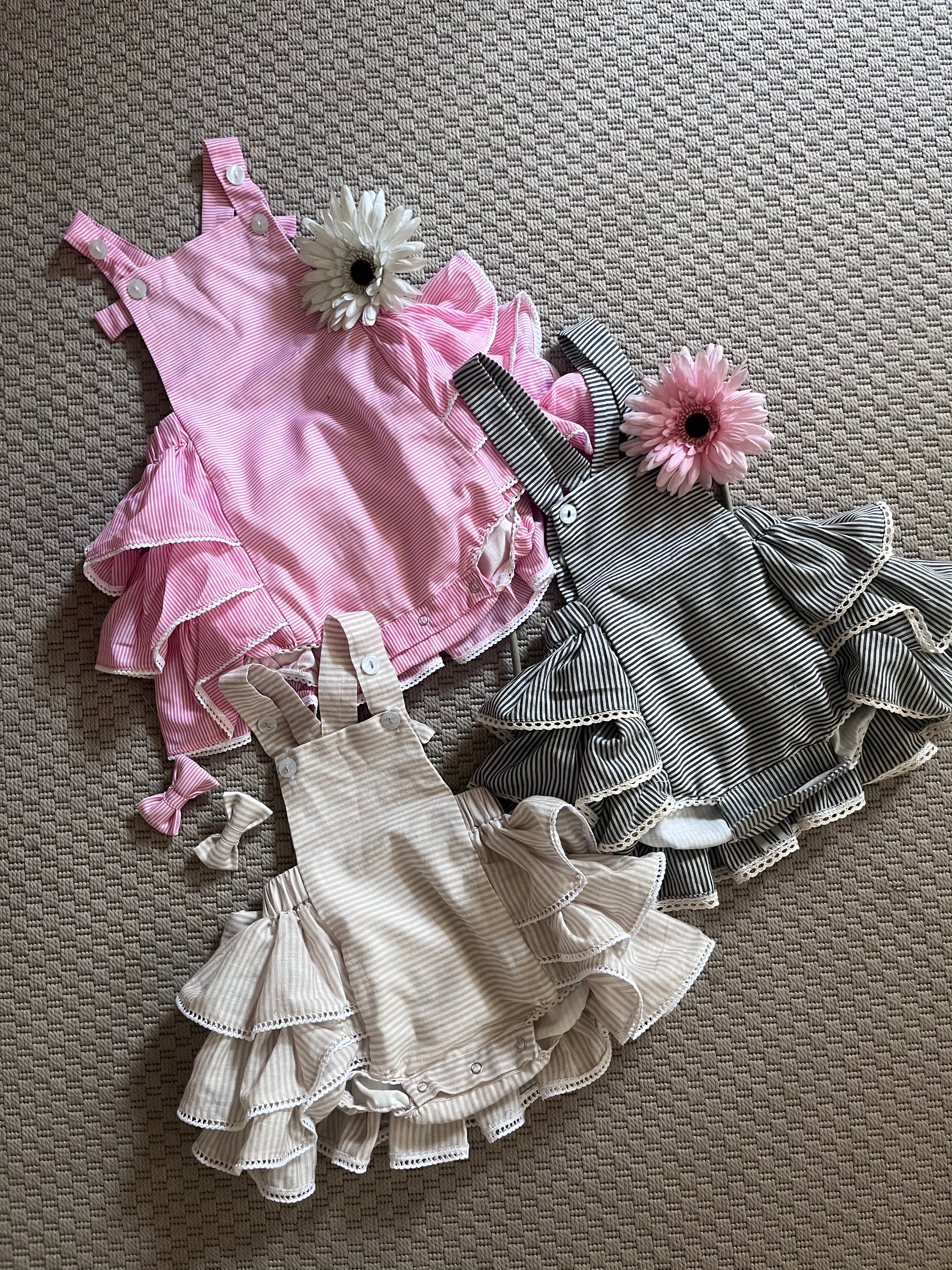 Striped Hamper of Ruffled Bum Rompers